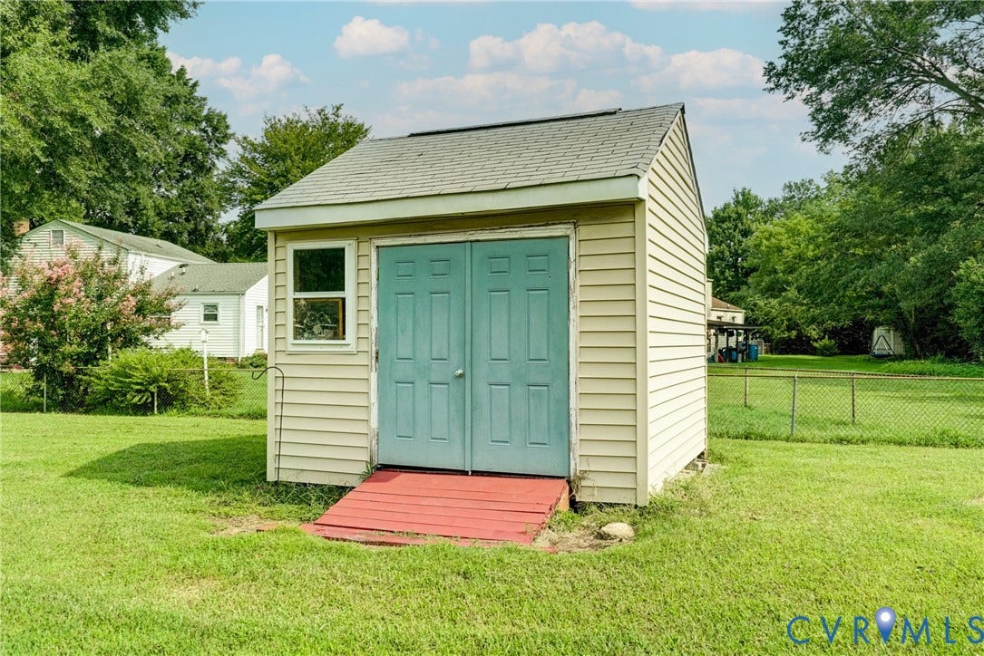 10104 Terry Court, Henrico, VA 23228 Storage shed featuring double doors, a single window, and a gabled roof