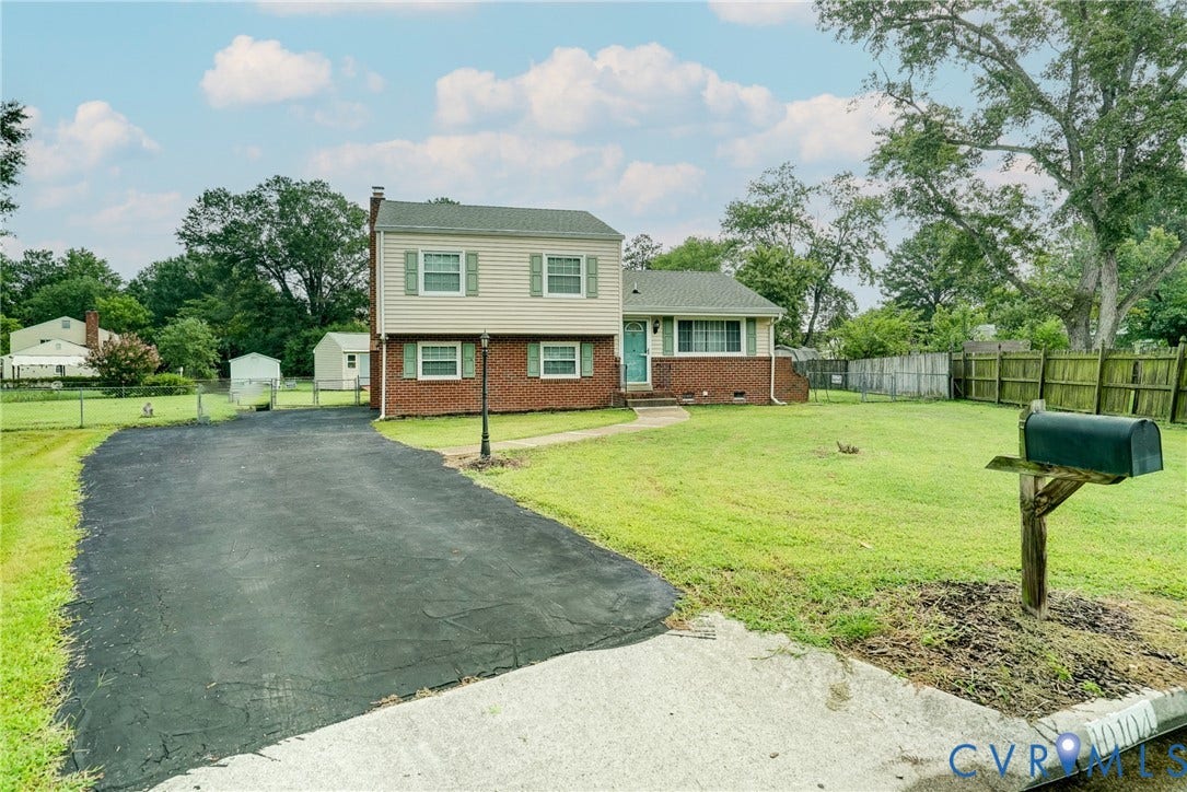 10104 Terry Court, Henrico, VA 23228 Two-story exterior with brick and siding, featuring a substantial front lawn and mature trees