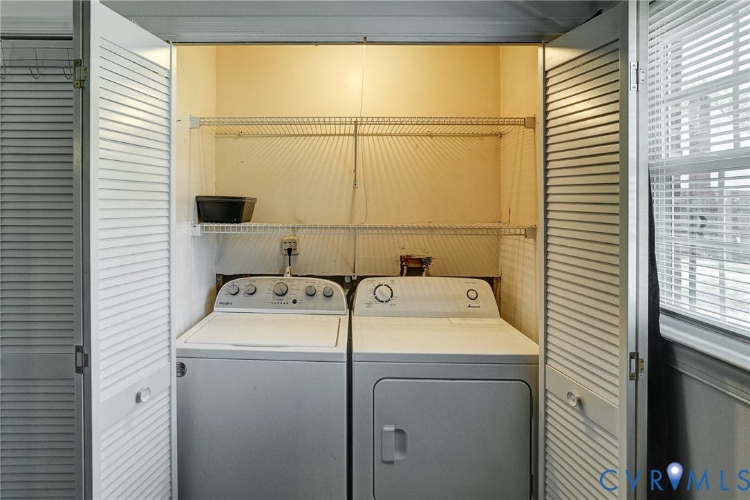 10104 Terry Court, Henrico, VA 23228 Laundry closet with bi-fold louvered doors, wire shelving, and overhead lighting