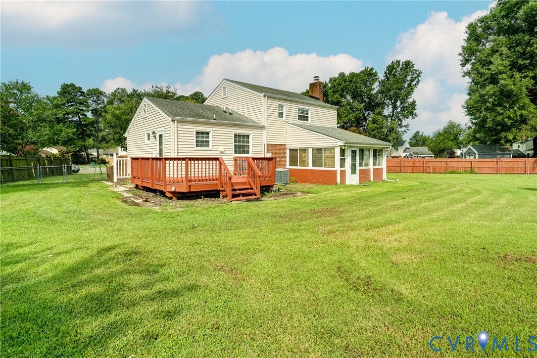 10104 Terry Court, Henrico, VA 23228 Expansive green lawn, red-stained wood deck, screened porch, and privacy fencing