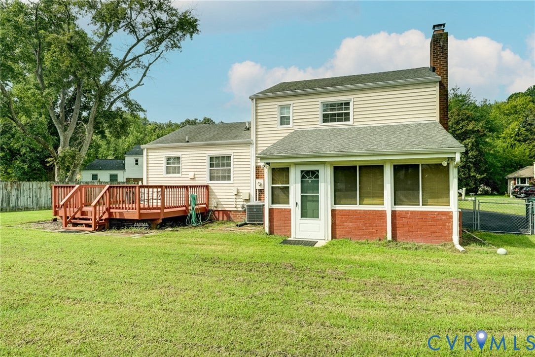 10104 Terry Court, Henrico, VA 23228 Spacious backyard with a large wood deck, screen-enclosed porch, and wood privacy fencing
