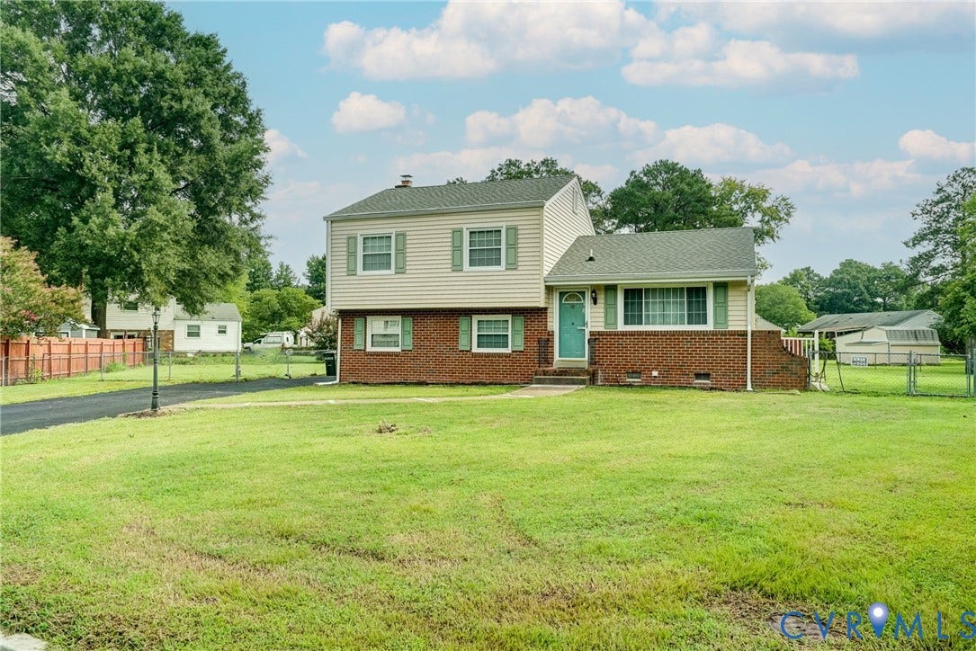 10104 Terry Court, Henrico, VA 23228 Two-story residence featuring brick and siding facade, contrasting green shutters, and a teal entry door
