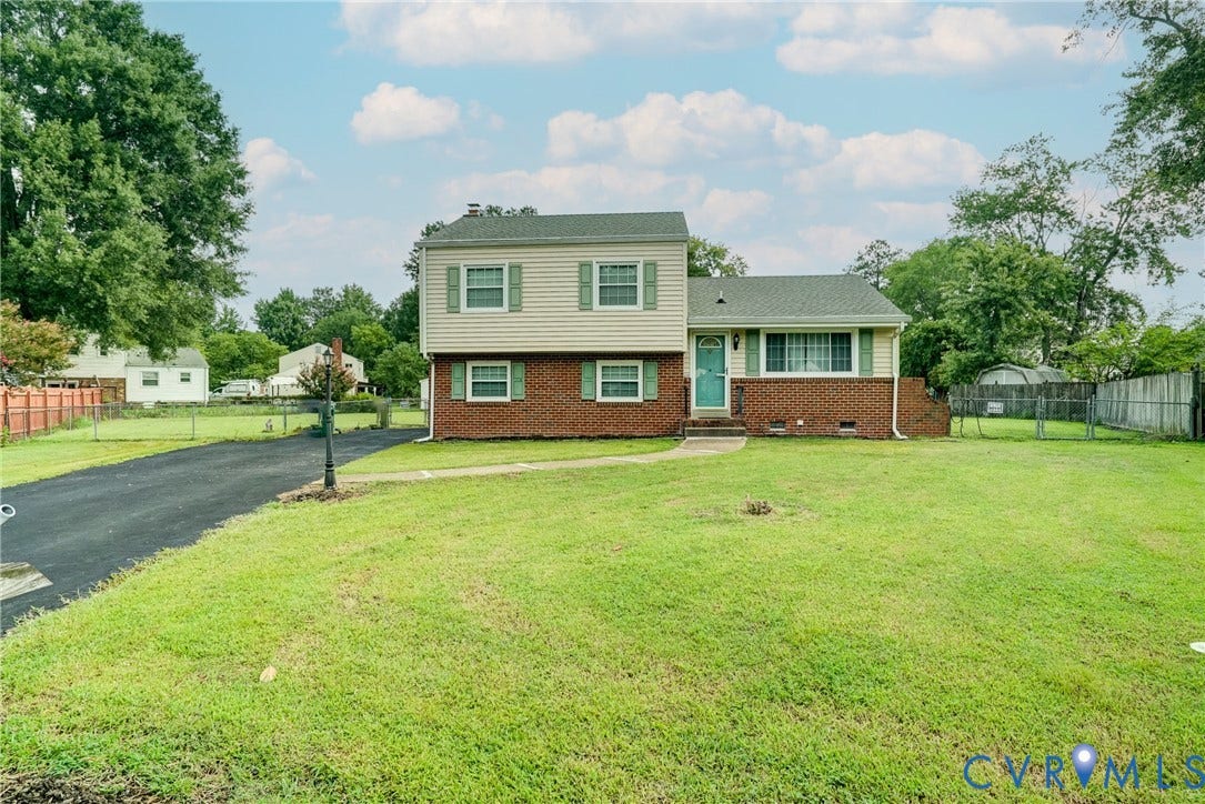 10104 Terry Court, Henrico, VA 23228 Split-level residence featuring brick and siding exterior, a front entry door, and a paved driveway