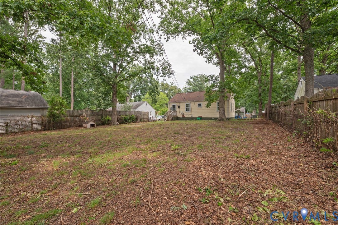 1704 Westhill Road, Richmond, VA 23226 Expansive backyard with a wood privacy fence and mature trees