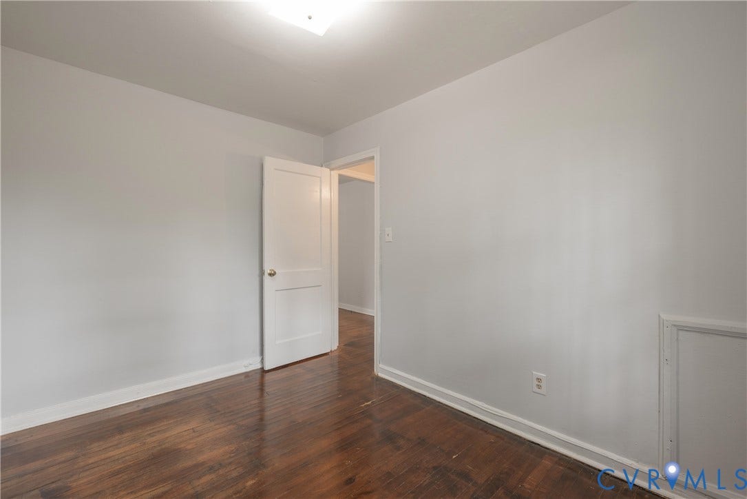 1704 Westhill Road, Richmond, VA 23226 Bedroom #3 with Wood-finish flooring, white trim, and a white interior door