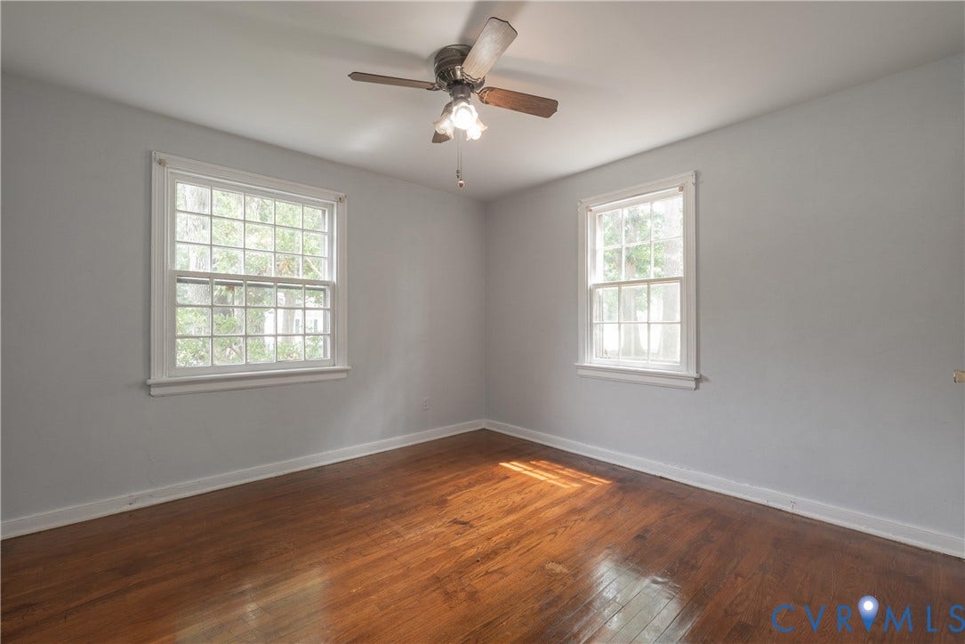 1704 Westhill Road, Richmond, VA 23226 Primary Bedroom with hardwood flooring, dual windows with natural light, ceiling fan with integrated lighting, and fresh neutral walls