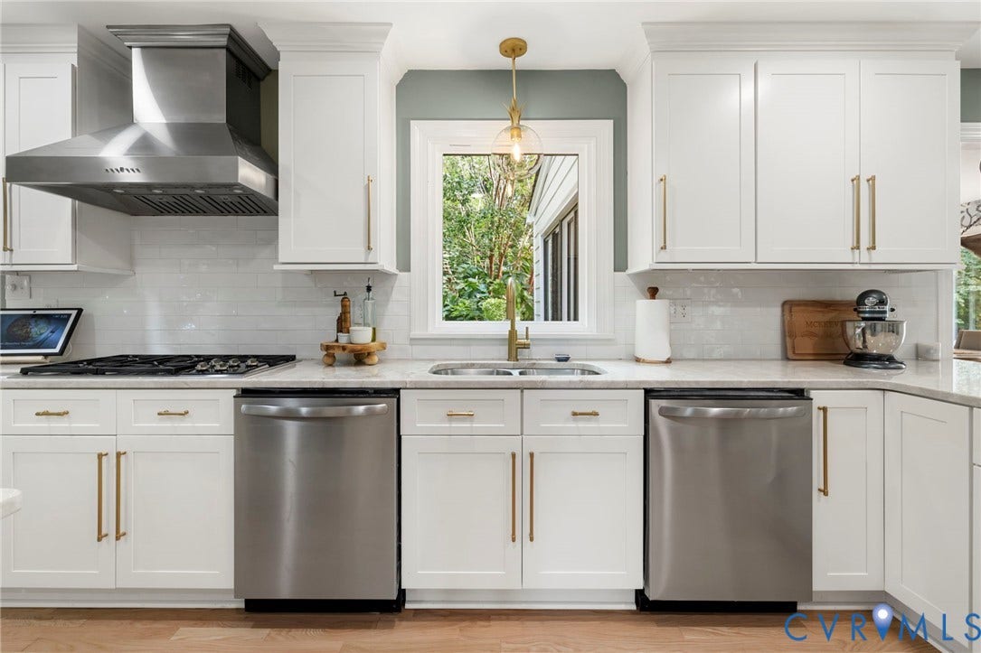 13531 W Salisbury Road, Salisbury, Midlothian, VA 23113 White shaker cabinetry, stainless steel appliances, undermount sink, pendant lighting, and light-toned countertops