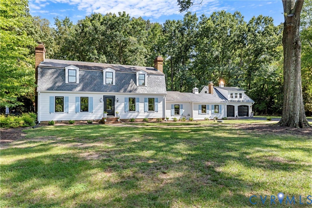 13531 W Salisbury Road, Salisbury, Midlothian, VA 23113 White siding exterior featuring a gambrel roof, dormer windows, and attached garage