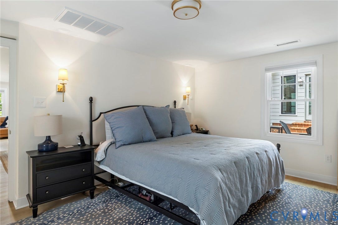 13531 W Salisbury Road, Salisbury, Midlothian, VA 23113 Recessed ceiling light, wall-mounted sconces, light wood-finish flooring, and a window with white trim