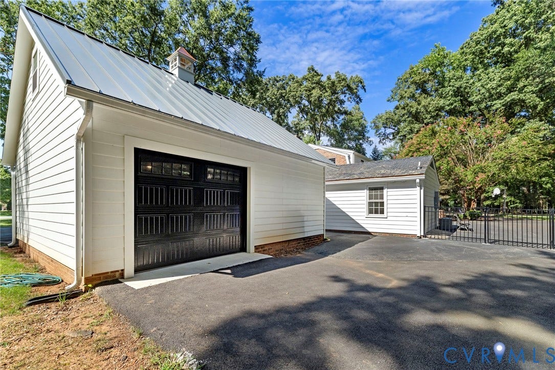 13531 W Salisbury Road, Salisbury, Midlothian, VA 23113 Detached garage featuring white siding, a cupola, and a metal roof