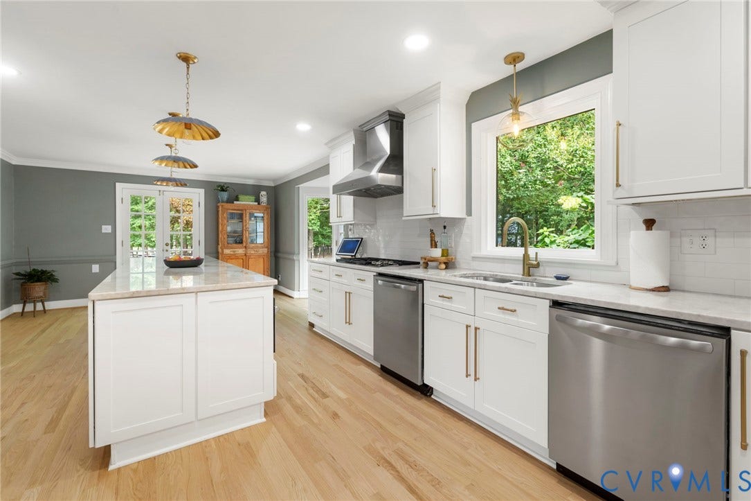 13531 W Salisbury Road, Salisbury, Midlothian, VA 23113 Kitchen featuring a central island, white cabinetry, stainless steel appliances, wood-finish flooring, and light-colored countertops