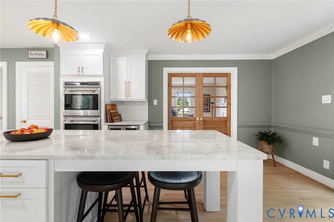 13531 W Salisbury Road, Salisbury, Midlothian, VA 23113 Kitchen featuring a white marble-finish island, white cabinetry, stainless steel double ovens, and wood-finish flooring