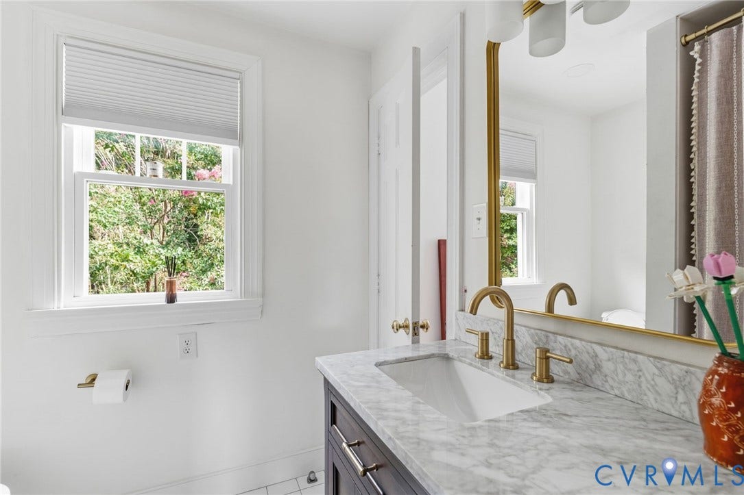 13531 W Salisbury Road, Salisbury, Midlothian, VA 23113 Single vanity with a rectangular undermount sink, marble-finish countertop, and brushed brass fixtures