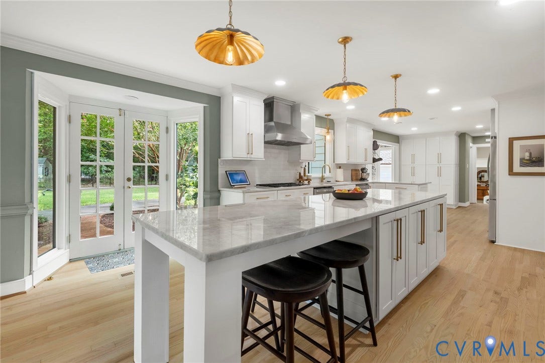 13531 W Salisbury Road, Salisbury, Midlothian, VA 23113 Gourmet kitchen with a large center island, white cabinetry, light wood-finish flooring, and French doors