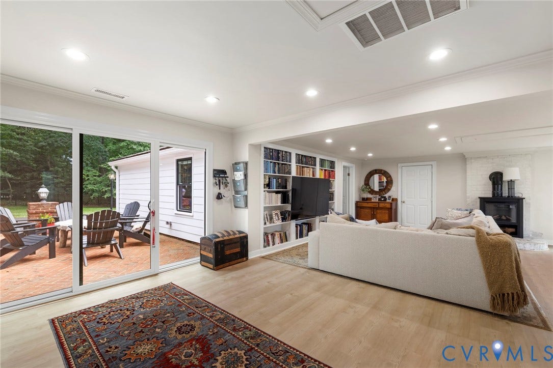 13531 W Salisbury Road, Salisbury, Midlothian, VA 23113 Recessed lighting, built-in shelving, wood-finish flooring, a brick patio, and sliding glass doors