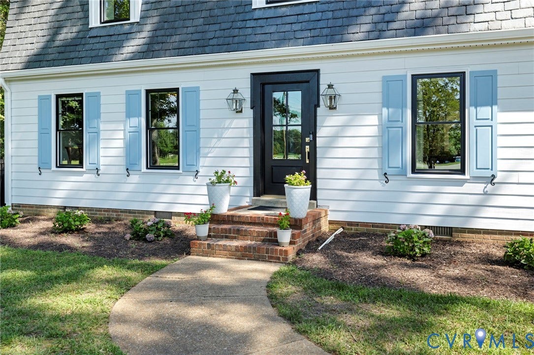 13531 W Salisbury Road, Salisbury, Midlothian, VA 23113 White siding exterior with black-framed windows and light blue shutters