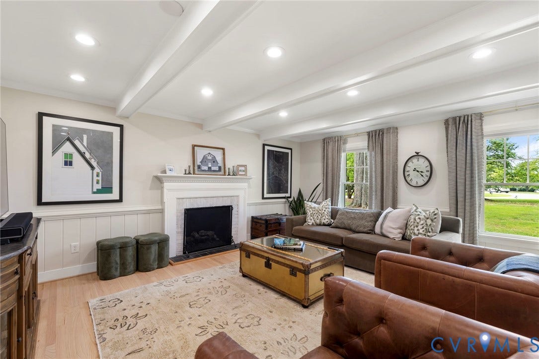 13531 W Salisbury Road, Salisbury, Midlothian, VA 23113 Spacious living area featuring exposed ceiling beams, recessed lighting, a fireplace with a mantel, light wood-finish flooring, and multiple windows