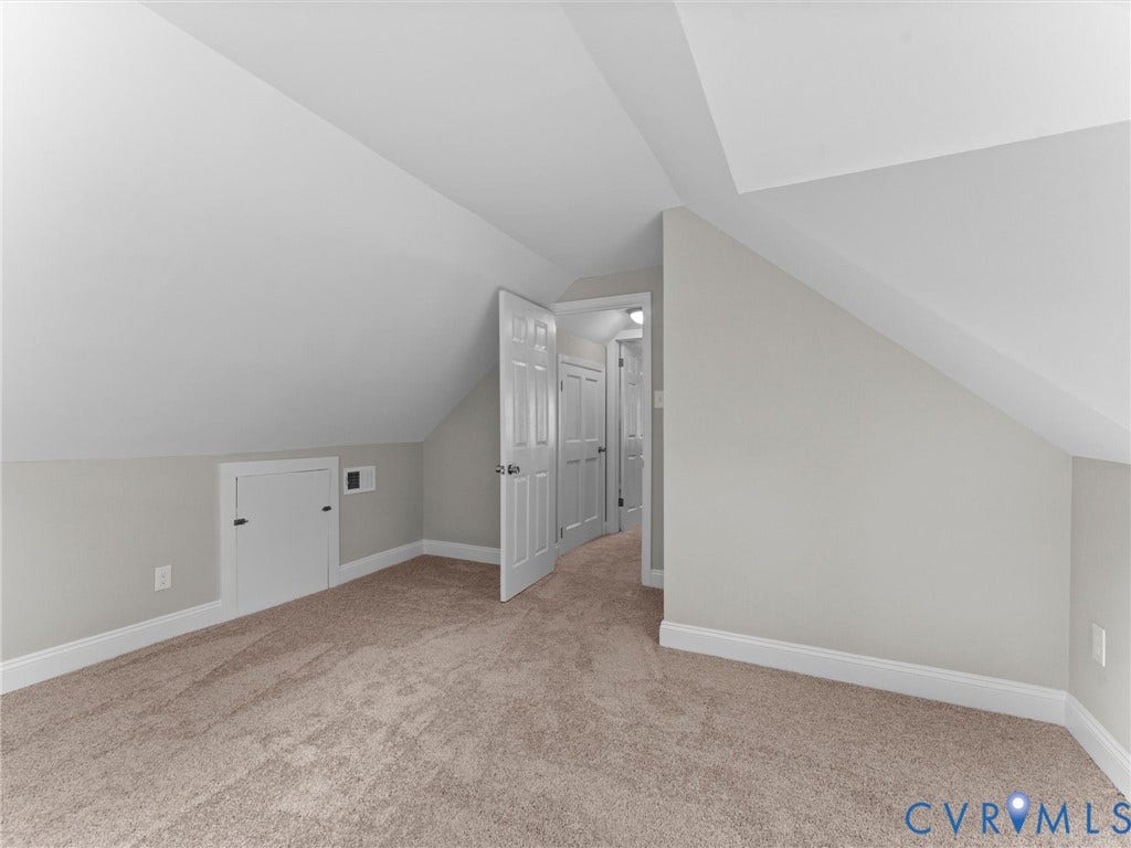 4818 Castlewood Road, Richmond, VA 23234 Sloped ceilings, neutral wall color, and light-toned carpeting
