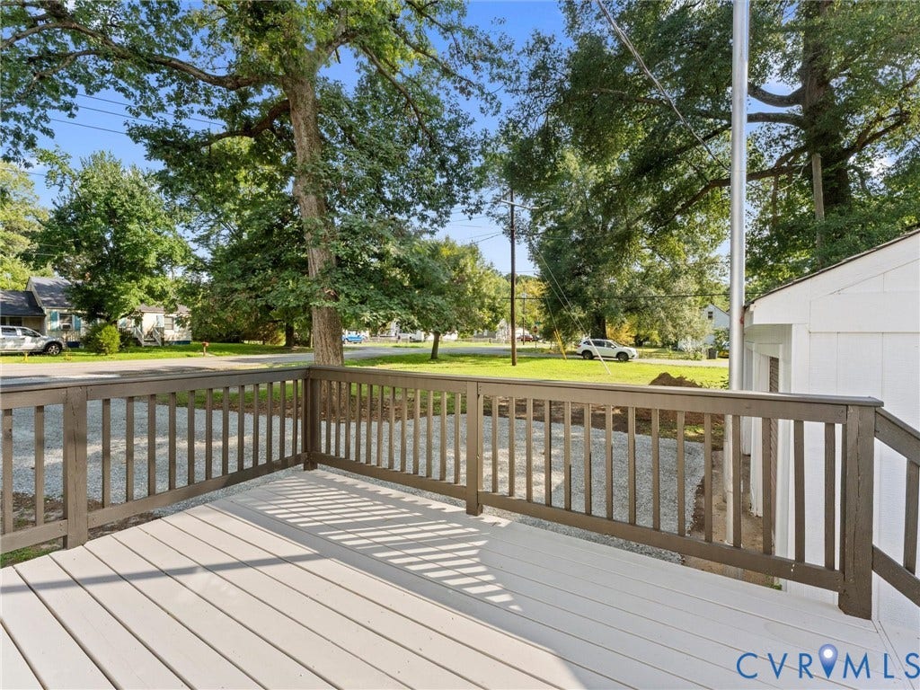 4818 Castlewood Road, Richmond, VA 23234 Light-colored decking with a dark-stained wood railing