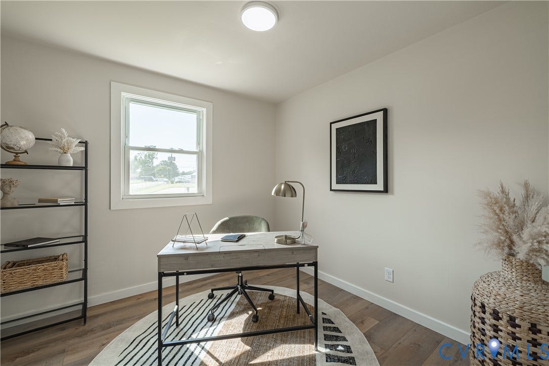 Recessed ceiling light, single window, wood-finish flooring, light-toned walls, and white trim