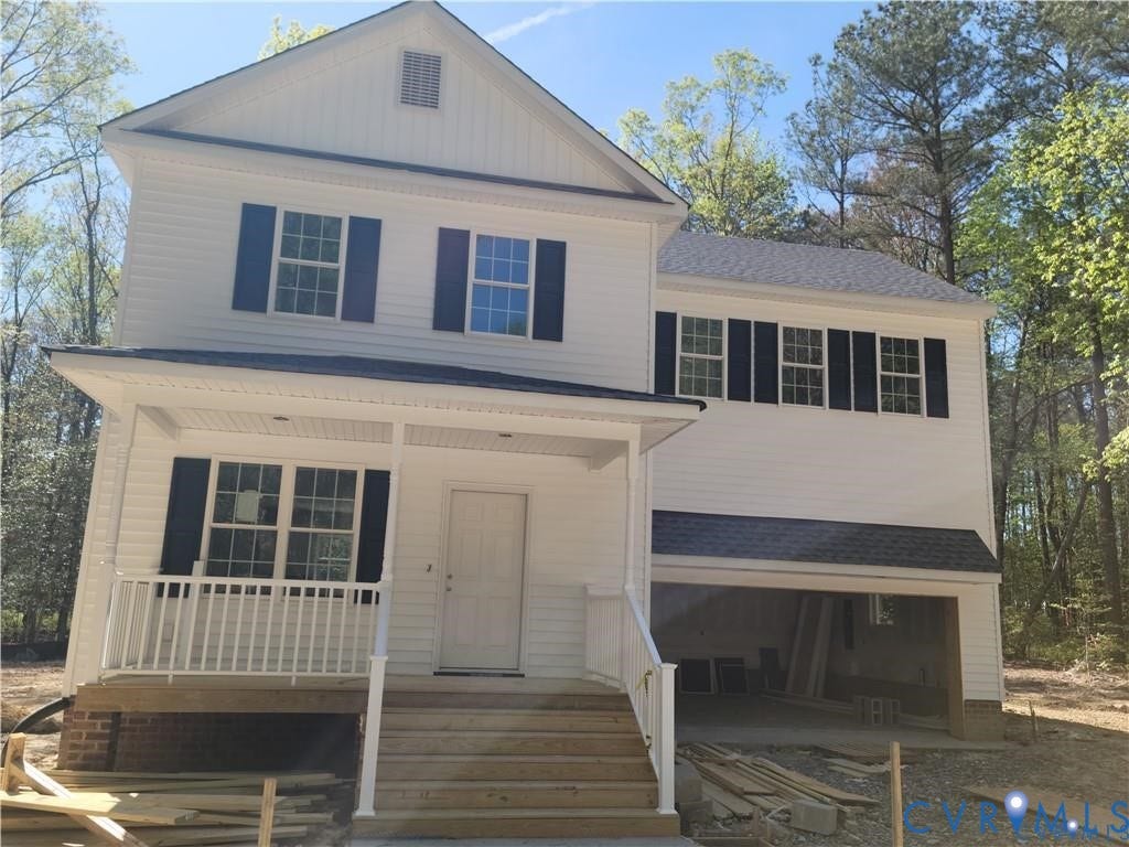 Lot 313 Shenandoah Crossing Drive, Gordonsville, VA 22942 Two-story residence featuring white siding, black shutters, and a covered front porch with white railings