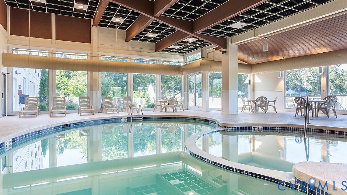 Lot 320 Bay Hill Road, Gordonsville, VA 22942 Indoor pool with integrated spa, floor-to-ceiling windows, exposed beam ceiling, and tiled surrounds