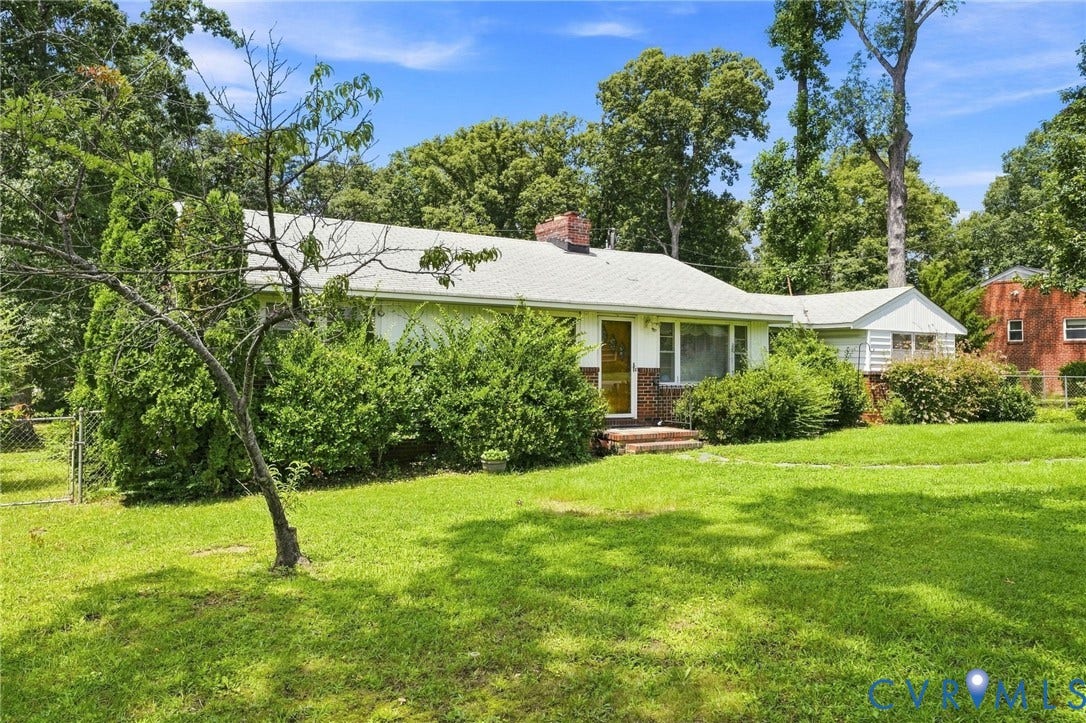 1904 Fon Du Lac Road, Henrico, VA 23229 Exterior featuring a white facade, brick accents, a gabled roof, a front entrance, and mature landscaping