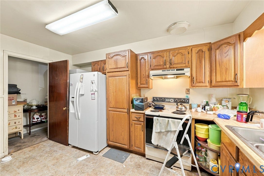 1904 Fon Du Lac Road, Henrico, VA 23229 Kitchen featuring wood cabinetry, laminate countertops, and hard surface flooring