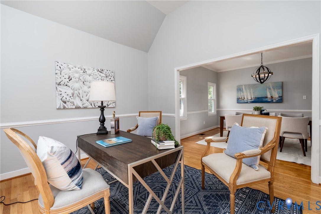 Vaulted ceiling, two-tone wall paint, crown molding, wood-finish flooring, and recessed lighting