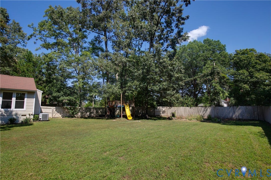 928 Marblethorpe Road, North Chesterfield, VA 23236 Expansive, level backyard features a full privacy fence and loads of space to spread out.