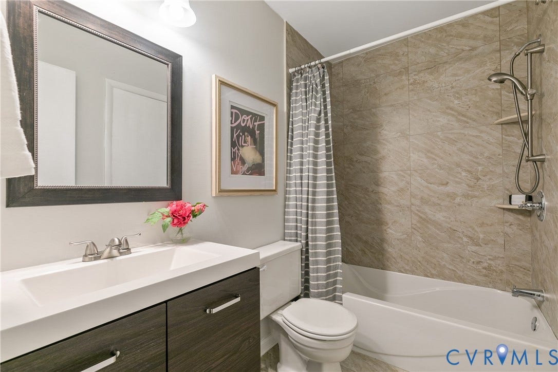 928 Marblethorpe Road, North Chesterfield, VA 23236 Renovated full bathroom with tile shower and floors.