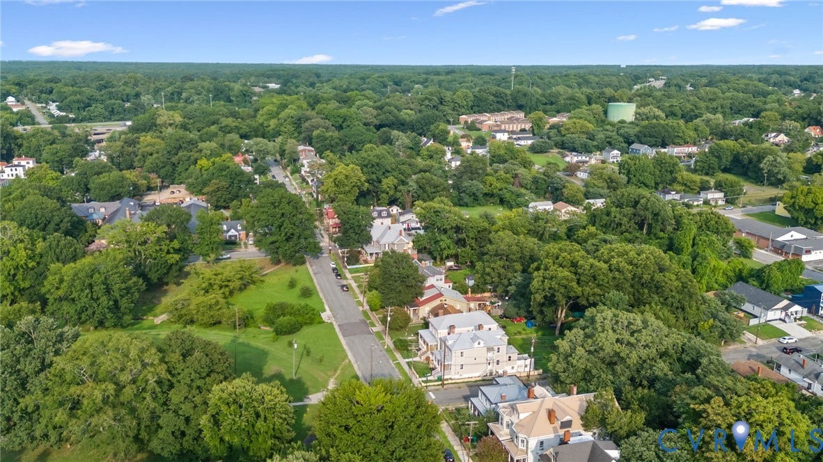 409 S Jefferson Street, Bolling, Petersburg, VA 23803 Aerial perspective showcasing a residential area with dense tree canopy and visible street infrastructure