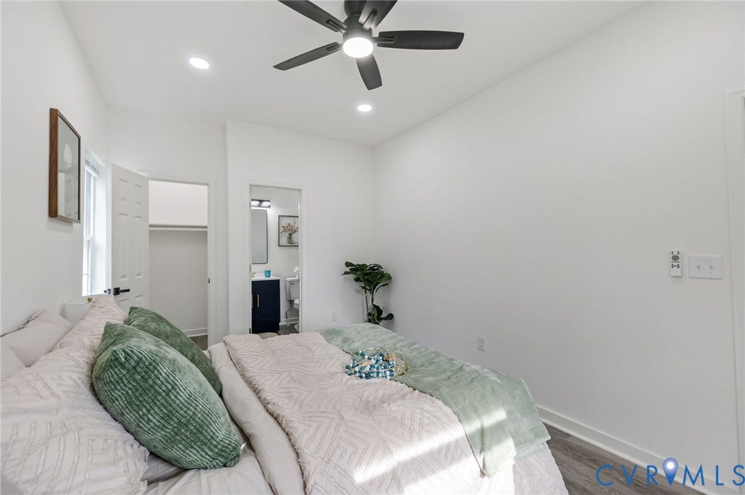 409 S Jefferson Street, Bolling, Petersburg, VA 23803 Vaulted ceiling with a ceiling fan, recessed lighting, wood-finish flooring, and a window