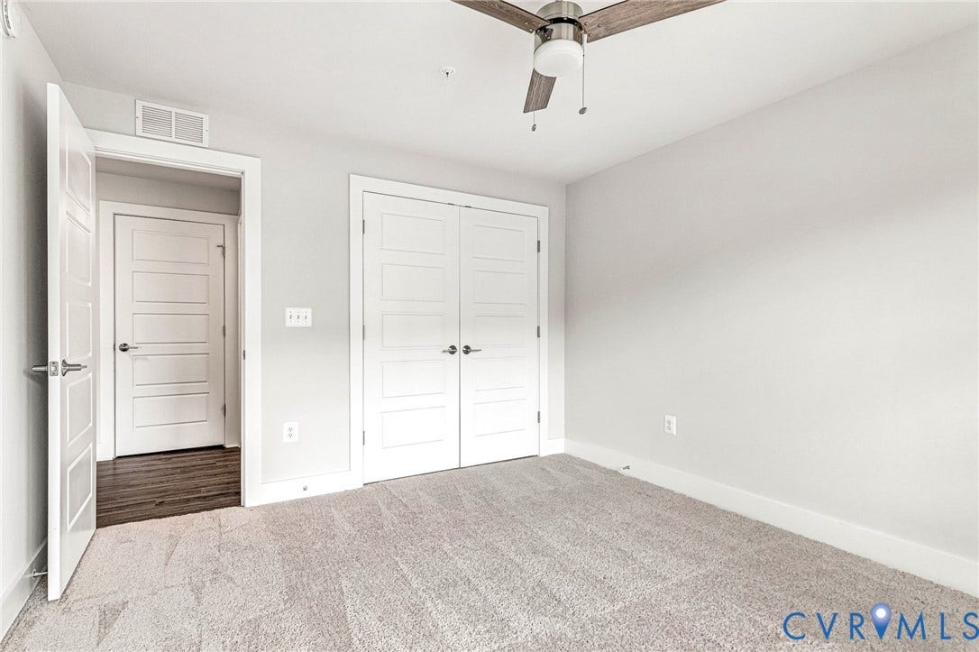 4347 Saunders Station Loop, #A, Glen Allen, VA 23233 Plush carpeting, wood-finish ceiling fan, and white paneled doors