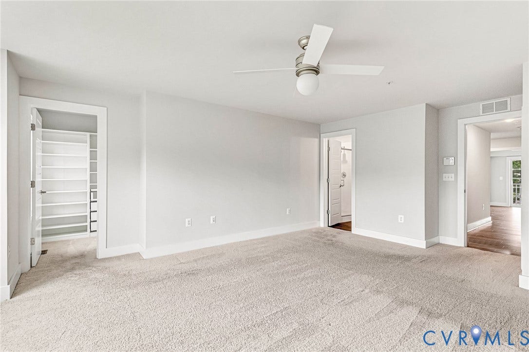 4347 Saunders Station Loop, #A, Glen Allen, VA 23233 Plush carpeting, a modern ceiling fan, and light-toned walls