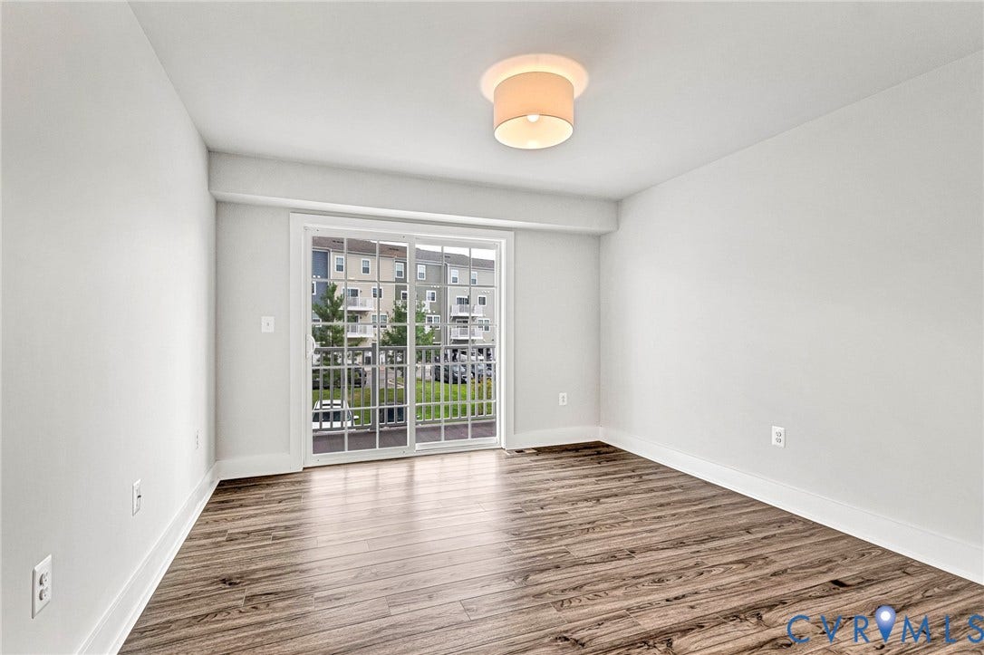 4347 Saunders Station Loop, #A, Glen Allen, VA 23233 Wood-finish flooring, white walls, white trim, and a ceiling-mounted light fixture