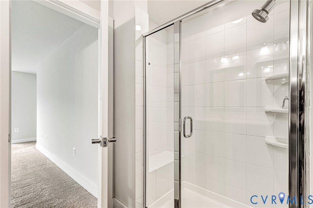 4347 Saunders Station Loop, #A, Glen Allen, VA 23233 Walk-in shower with clear glass enclosure and built-in bench