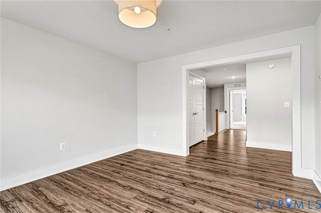 4347 Saunders Station Loop, #A, Glen Allen, VA 23233 Wood-finish flooring, white walls, and a contemporary ceiling light fixture