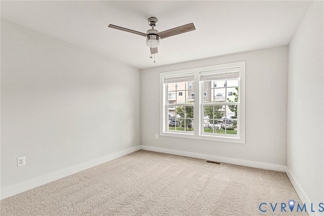 4347 Saunders Station Loop, #A, Glen Allen, VA 23233 Neutral wall paint, plush carpeting, dual pane windows, and a ceiling fan with light fixture