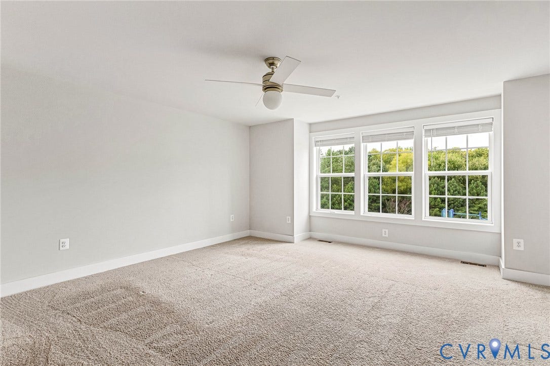 4347 Saunders Station Loop, #A, Glen Allen, VA 23233 Expansive room with neutral carpeting, light-toned walls, and a ceiling fan with integrated lighting