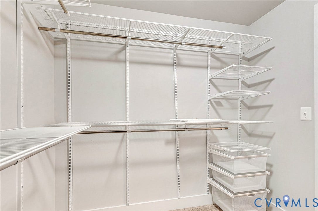 4347 Saunders Station Loop, #A, Glen Allen, VA 23233 Spacious walk-in closet featuring floor-to-ceiling wire shelving with multiple tiers, chrome hanging rods, and abundant storage compartments