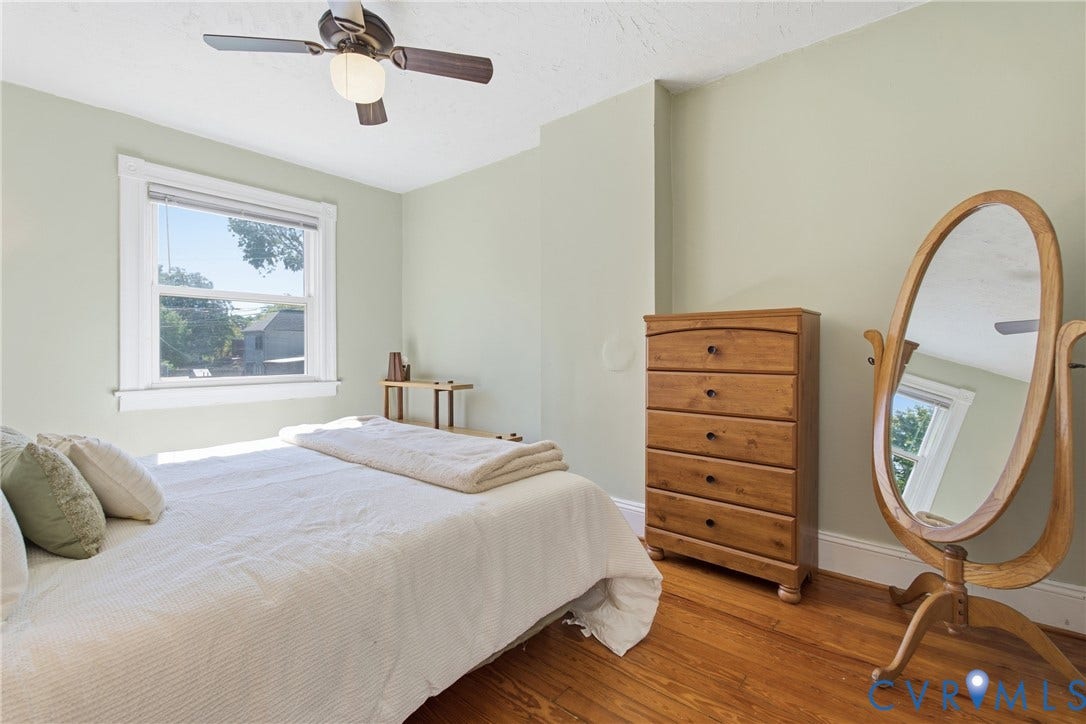 212 S Belmont Avenue, Carytown, Richmond, VA 23221 Hardwood flooring, painted walls, ceiling fan with integrated lighting, and a single window