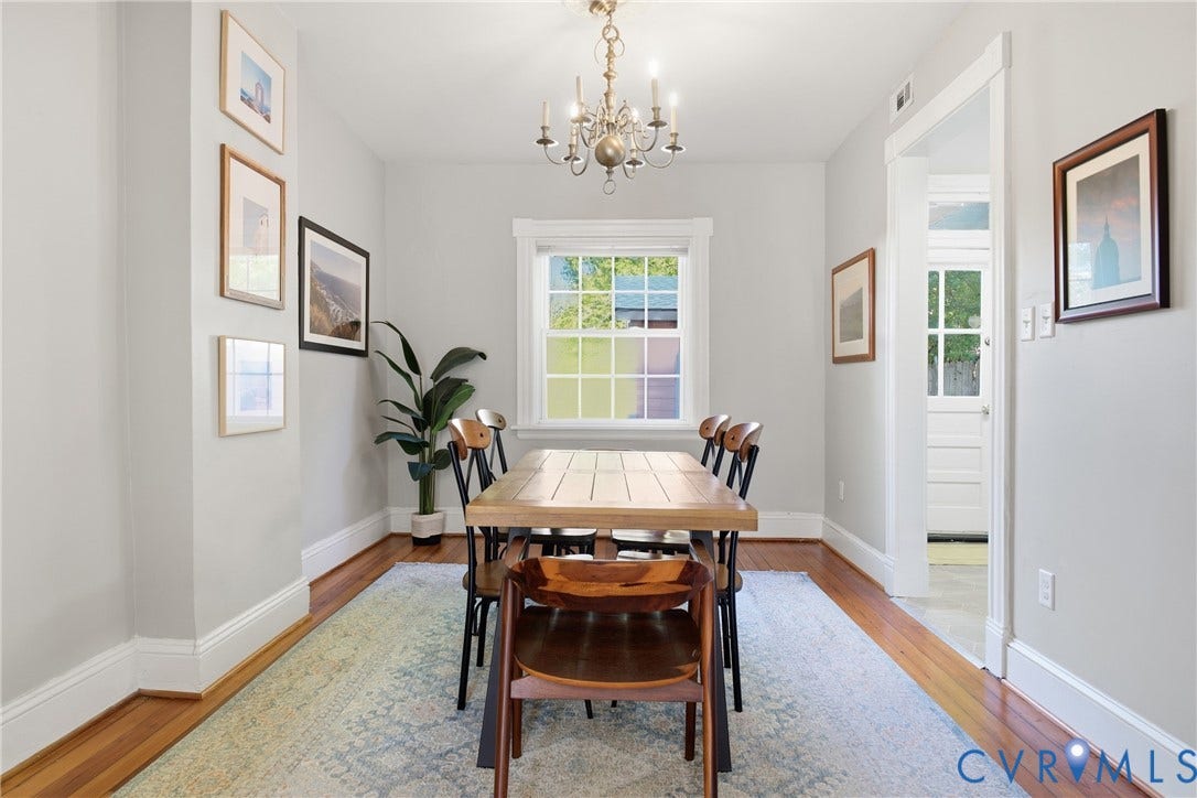 212 S Belmont Avenue, Carytown, Richmond, VA 23221 Hardwood flooring, painted walls, white trim, recessed window with grid, and overhead chandelier