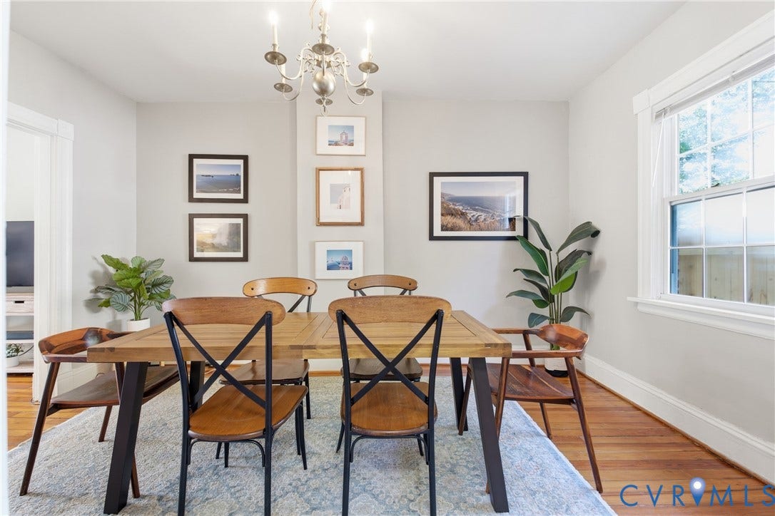 212 S Belmont Avenue, Carytown, Richmond, VA 23221 Wood-finish flooring with a neutral wall color, featuring a window with white trim, and a chandelier lighting fixture