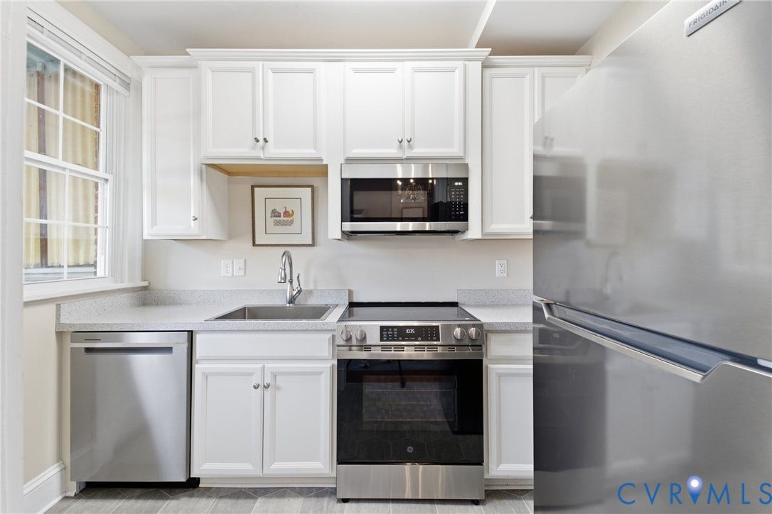 212 S Belmont Avenue, Carytown, Richmond, VA 23221 White cabinetry, stainless steel appliances, light-toned countertops, and a single-basin sink