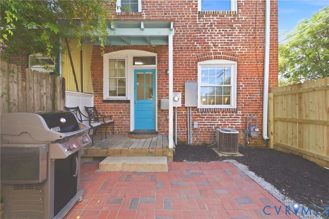 212 S Belmont Avenue, Carytown, Richmond, VA 23221 Brick exterior with a red brick paver patio, a wood deck, and a new privacy fence