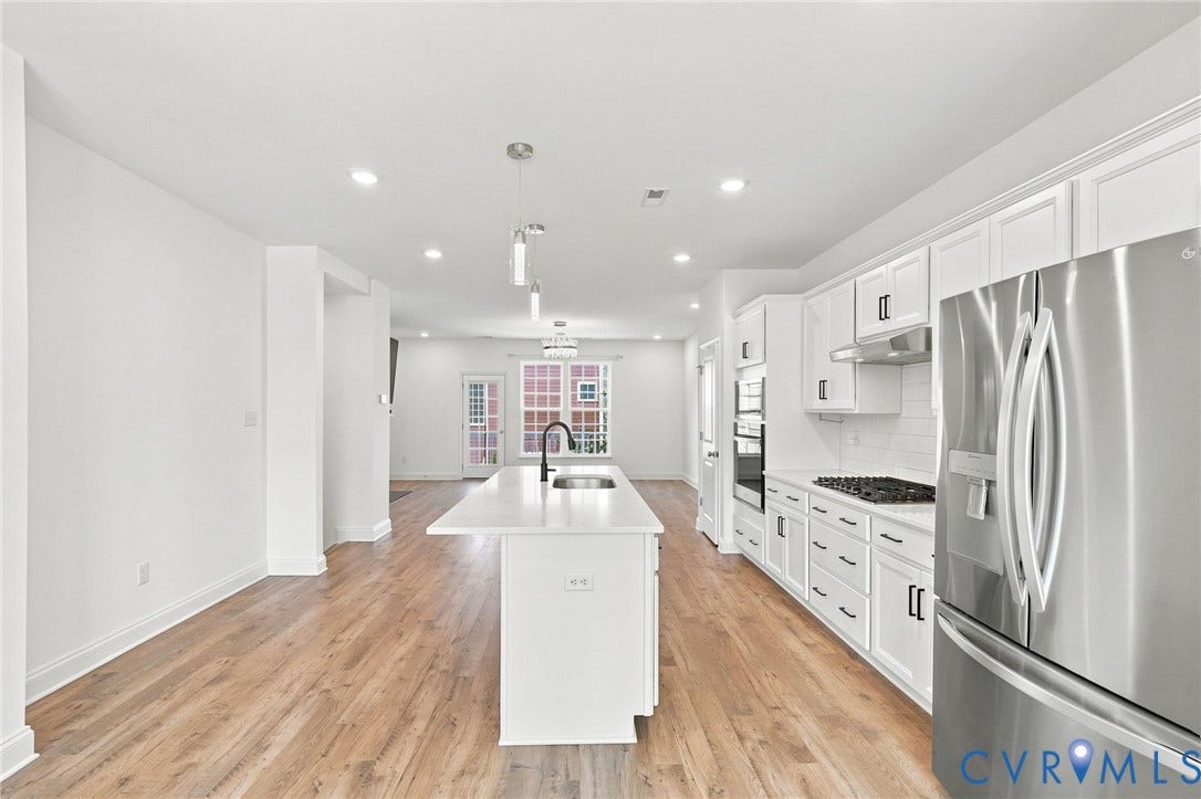 13820 Village View Drive, Midlothian, VA 23114 Kitchen with a center island, white cabinetry, stainless steel appliances, wood-finish flooring, and recessed lighting
