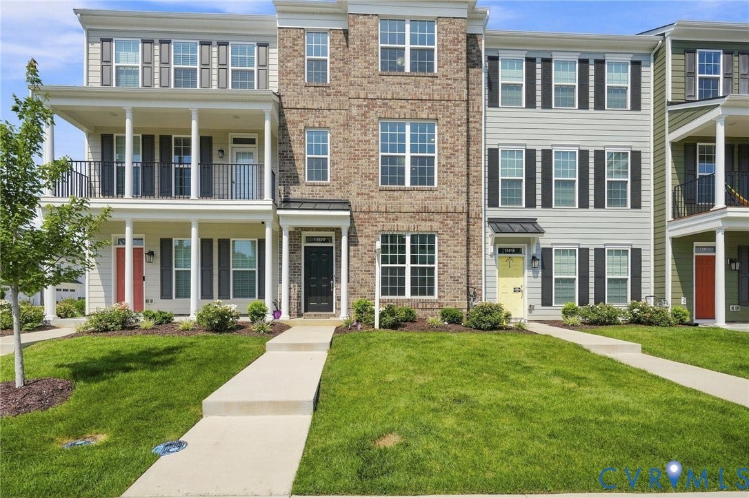 13820 Village View Drive, Midlothian, VA 23114 Brick and siding exterior with dark shutters, multiple balconies, and front entry sidewalk