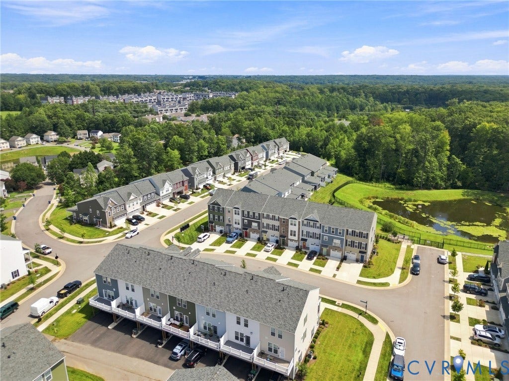 13820 Village View Drive, Midlothian, VA 23114 Residential development featuring townhomes with attached garages and varied facades
