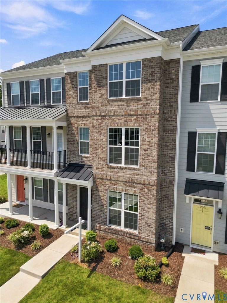 13820 Village View Drive, Midlothian, VA 23114 Brick exterior with multiple windows, covered entrance, and a balcony